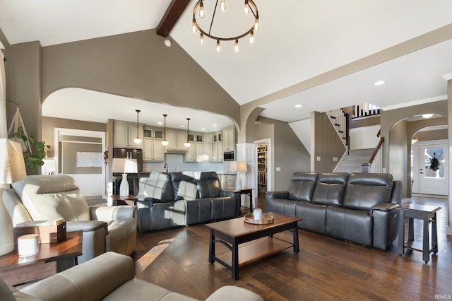 living room with beamed ceiling, dark wood-type flooring, high vaulted ceiling, and a chandelier