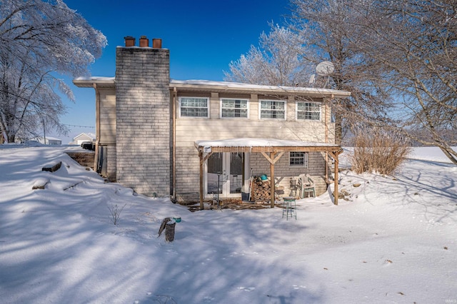 view of snow covered property