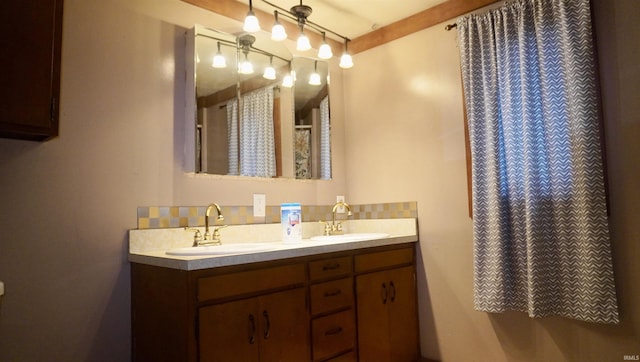 bathroom with backsplash and vanity