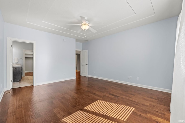 empty room featuring ceiling fan and wood-type flooring