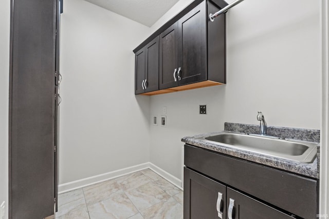 laundry room with cabinets, washer hookup, electric dryer hookup, and sink