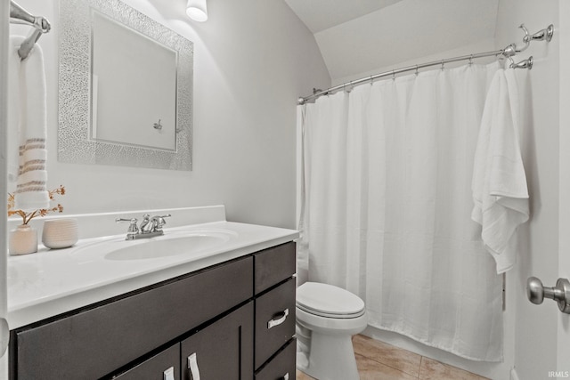 bathroom featuring curtained shower, tile patterned floors, lofted ceiling, toilet, and vanity