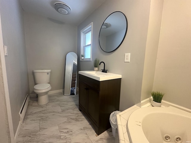 bathroom featuring vanity, a tub to relax in, toilet, and a baseboard heating unit