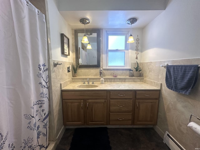 bathroom featuring baseboard heating, curtained shower, and vanity