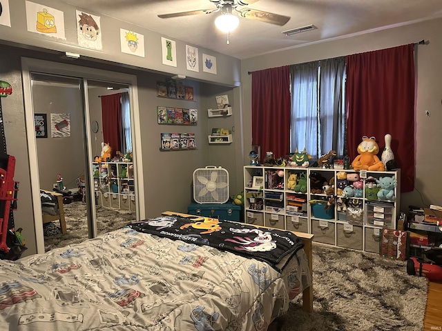 bedroom featuring hardwood / wood-style floors and ceiling fan