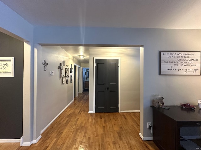 hall with wood-type flooring