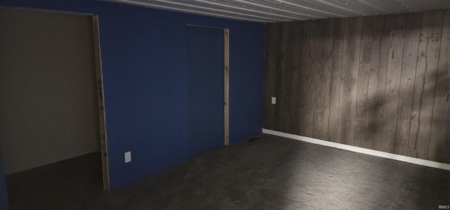 empty room with wooden walls