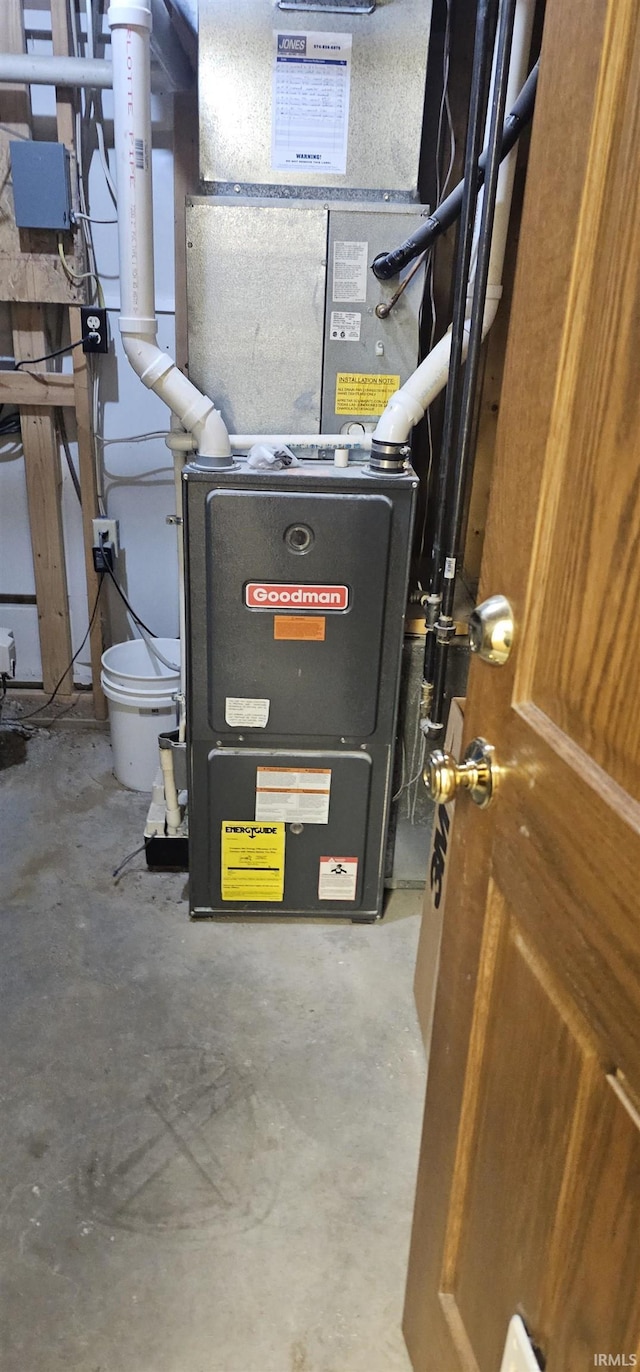 utility room featuring heating unit