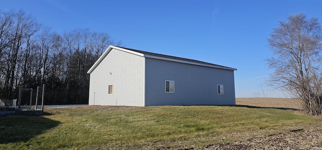 view of side of property with a yard