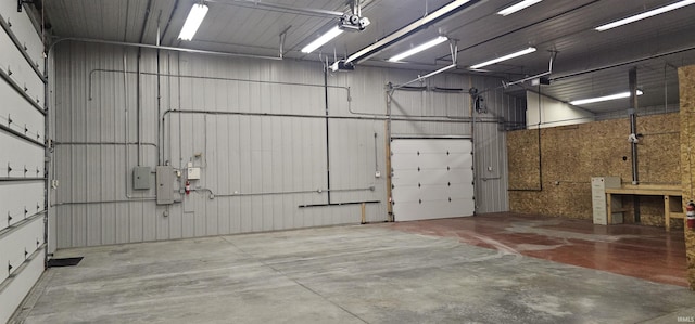 garage with electric panel and a garage door opener