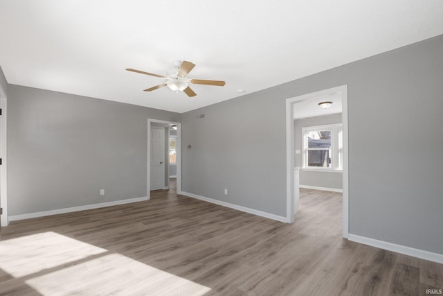 empty room featuring ceiling fan and wood-type flooring