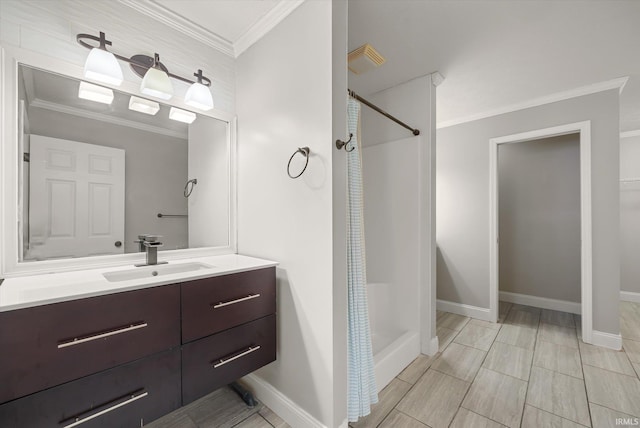 bathroom featuring vanity, ornamental molding, and walk in shower