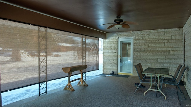 sunroom / solarium with ceiling fan