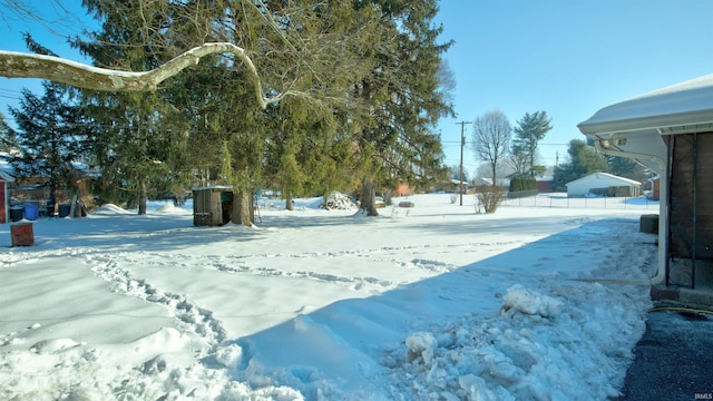 view of yard covered in snow