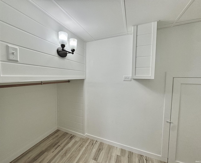 walk in closet with light wood-type flooring