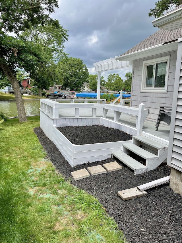 view of yard featuring a pergola and a water view