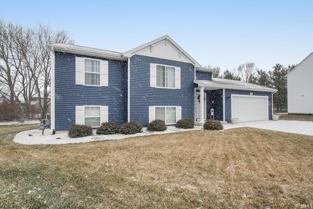 view of front of home featuring a garage and a front lawn