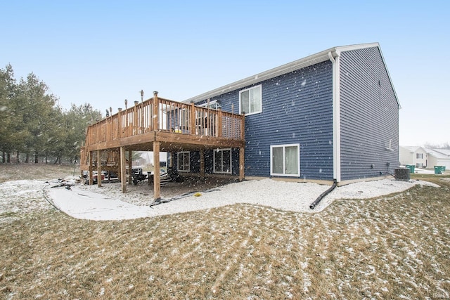 rear view of property featuring a deck