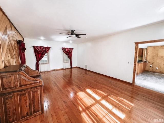 interior space with ceiling fan and light hardwood / wood-style flooring