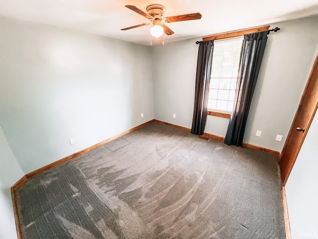 carpeted empty room with ceiling fan