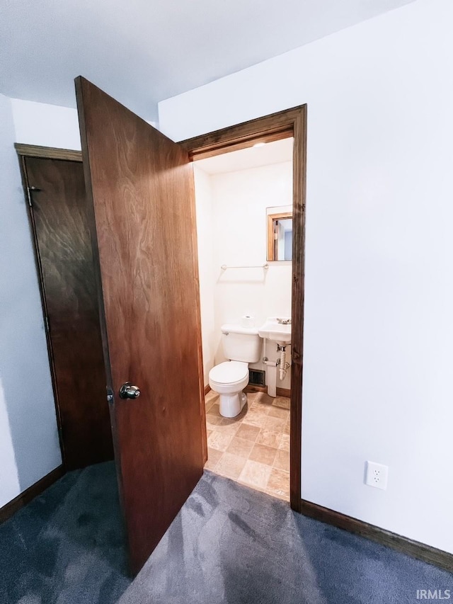 bathroom featuring toilet