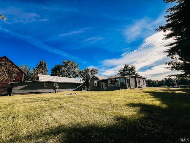 rear view of house with a lawn