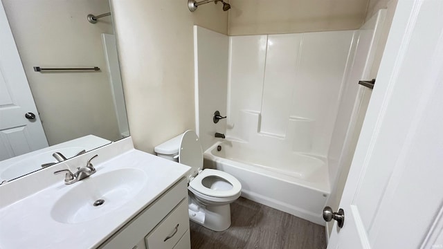 full bathroom featuring vanity, wood-type flooring,  shower combination, and toilet