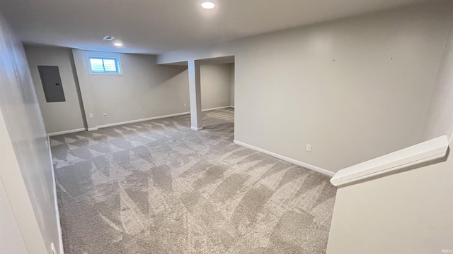 basement with carpet floors and electric panel