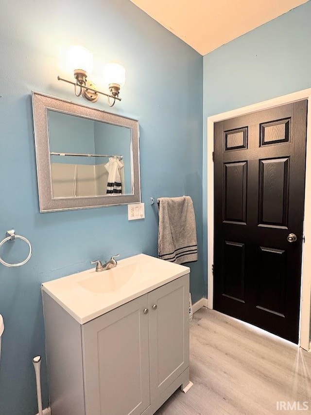 bathroom featuring vanity and wood-type flooring