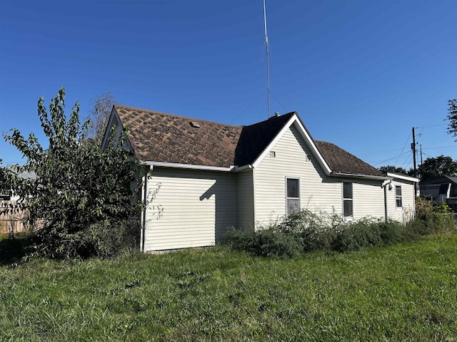 view of home's exterior featuring a lawn