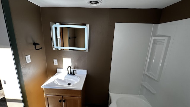 bathroom featuring vanity and shower / bath combination