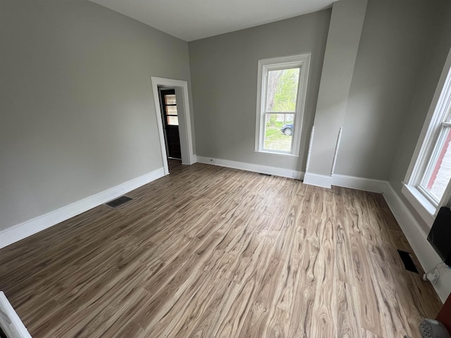 unfurnished room featuring light wood-type flooring