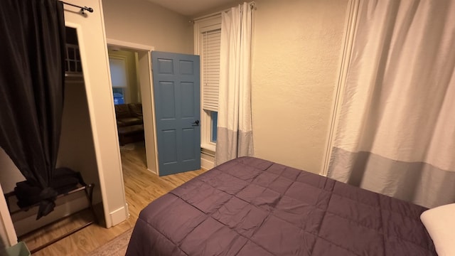 bedroom featuring light hardwood / wood-style floors