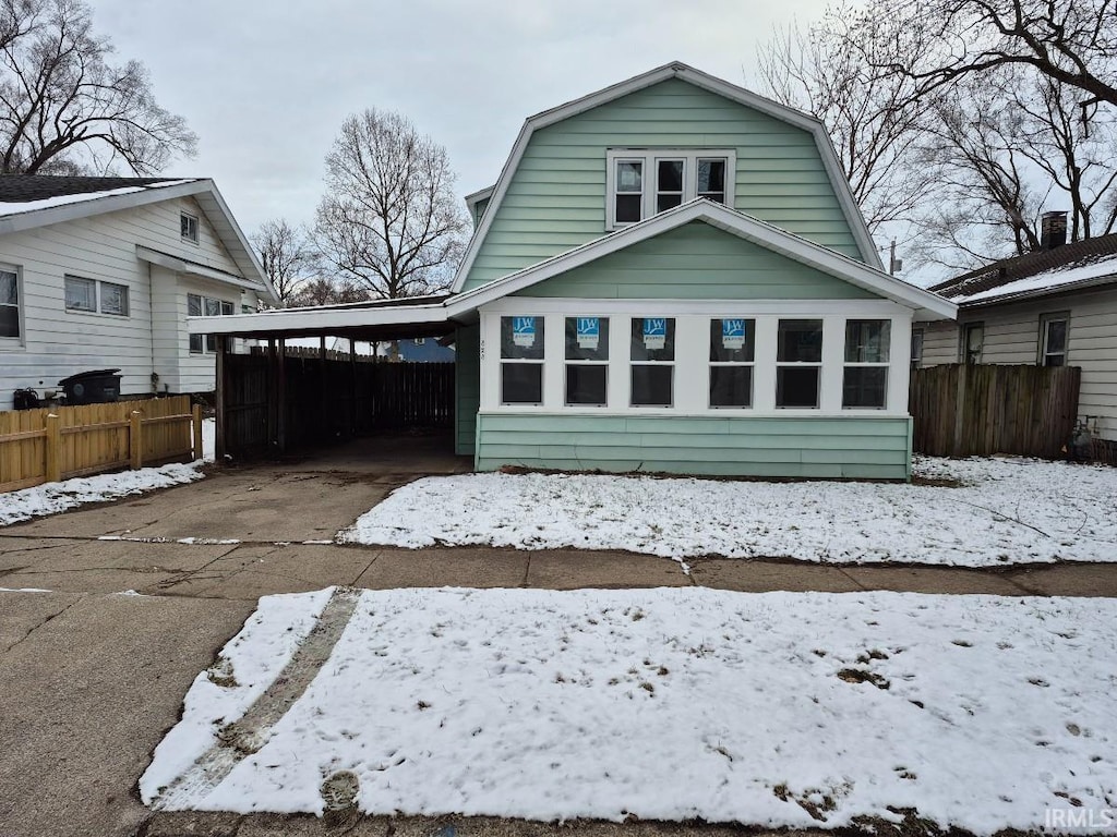 view of front of property with a carport