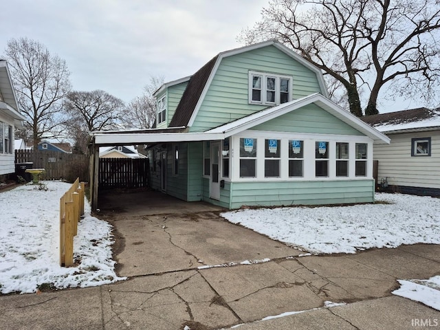 view of front of home with a carport