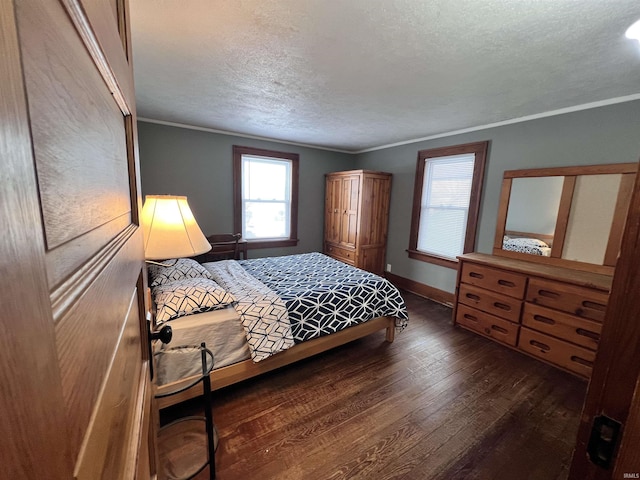 bedroom with a textured ceiling, dark hardwood / wood-style floors, and crown molding