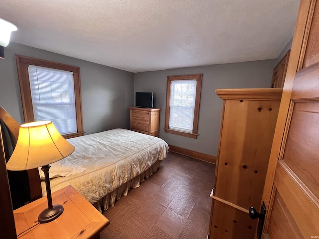 bedroom featuring a textured ceiling