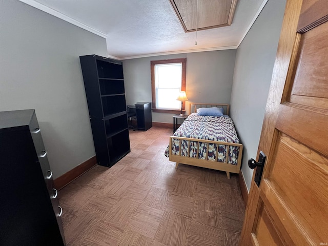 bedroom featuring a textured ceiling and ornamental molding