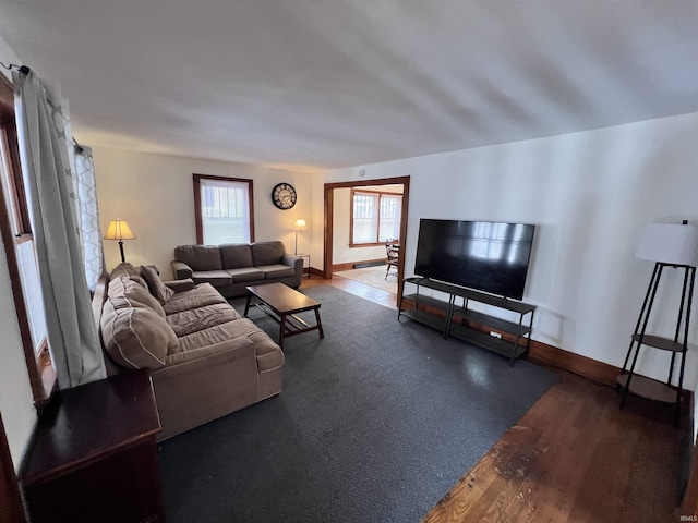 living room with dark hardwood / wood-style flooring