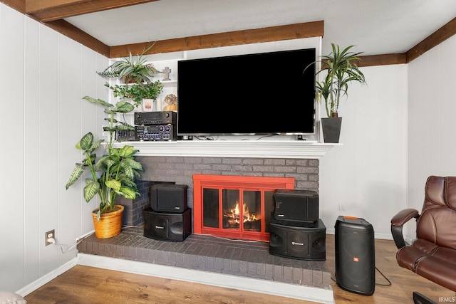 living room featuring a fireplace and hardwood / wood-style floors