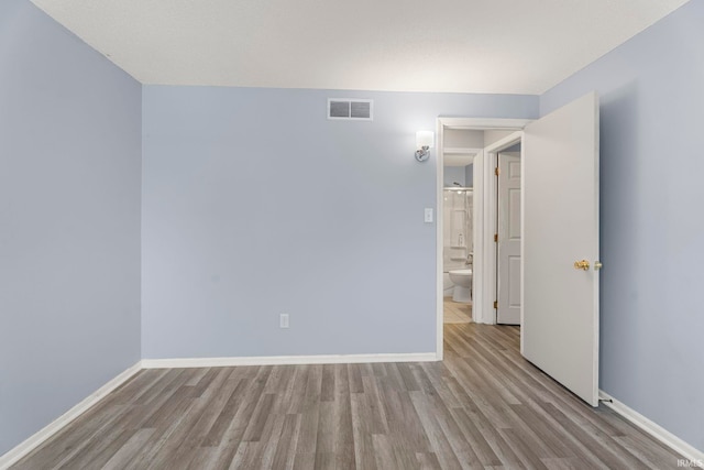 empty room featuring light hardwood / wood-style floors