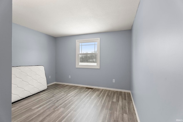 empty room featuring light hardwood / wood-style floors