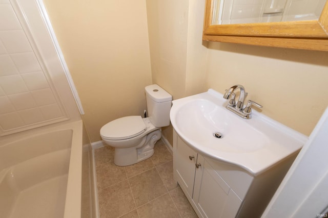 bathroom featuring tile patterned flooring, vanity, and toilet