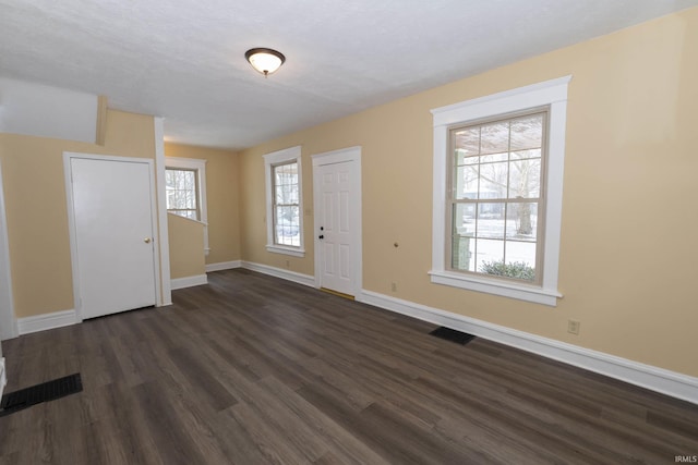 foyer with dark hardwood / wood-style flooring