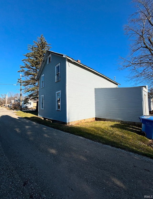 view of home's exterior featuring a lawn