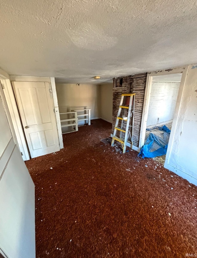 unfurnished bedroom with a textured ceiling