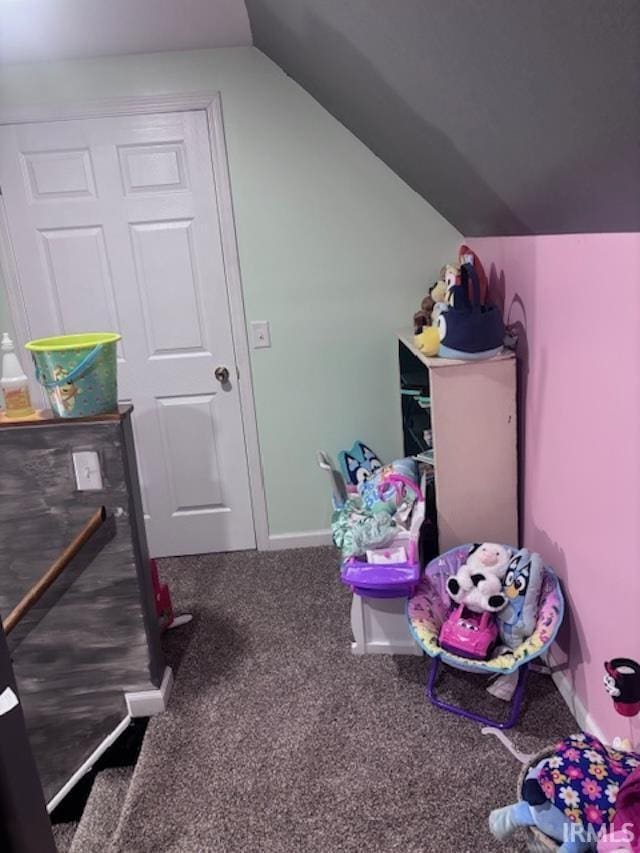 recreation room with carpet and lofted ceiling