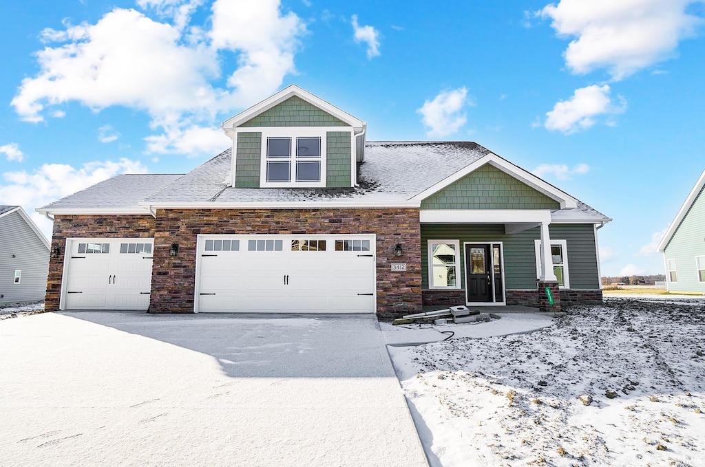 craftsman inspired home featuring covered porch