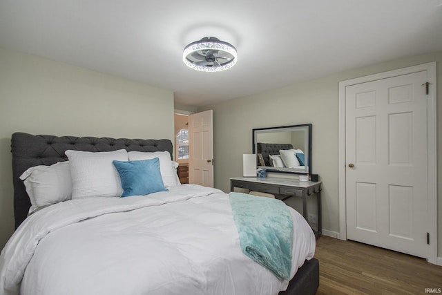 bedroom featuring dark hardwood / wood-style flooring