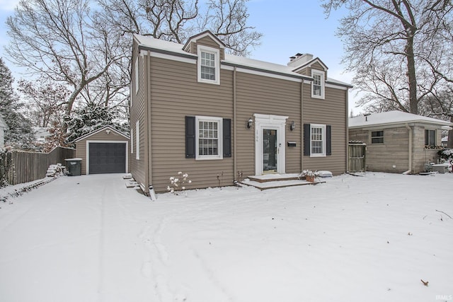 view of front of home featuring a garage and an outdoor structure